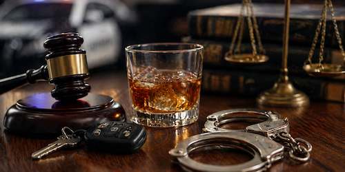 First offense DUI in Tennessee showing gavel, car keys, handcuffs, and alcohol representing legal consequences