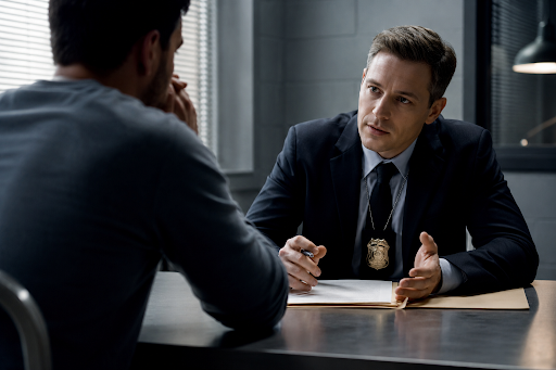 Detective questioning an individual during a criminal investigation before charges are filed